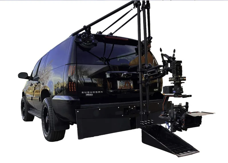 Black Chevrolet Suburban camera car with rear car-mount platform and three-axis gimbal head