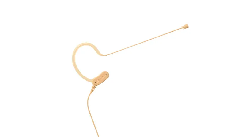 Semi-invisible skin-tone cheek microphone for on-camera presenters