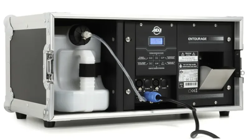 Professional stage hazer with fluid tank producing even atmospheric haze
