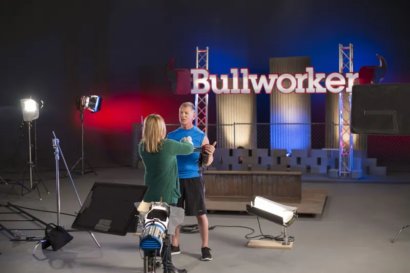 Crew setting up a cinematic lighting rig on the sound stage